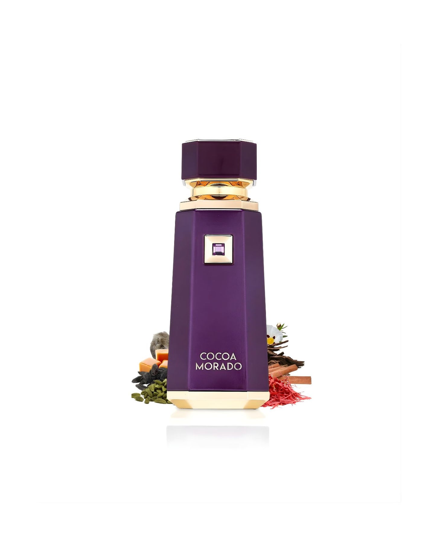The deep purple, geometric Cocoa Morado perfume bottle with gold accents, set amidst various scent ingredients, including green seeds, cinnamon sticks, saffron threads, and small white floral accents, against a white background
