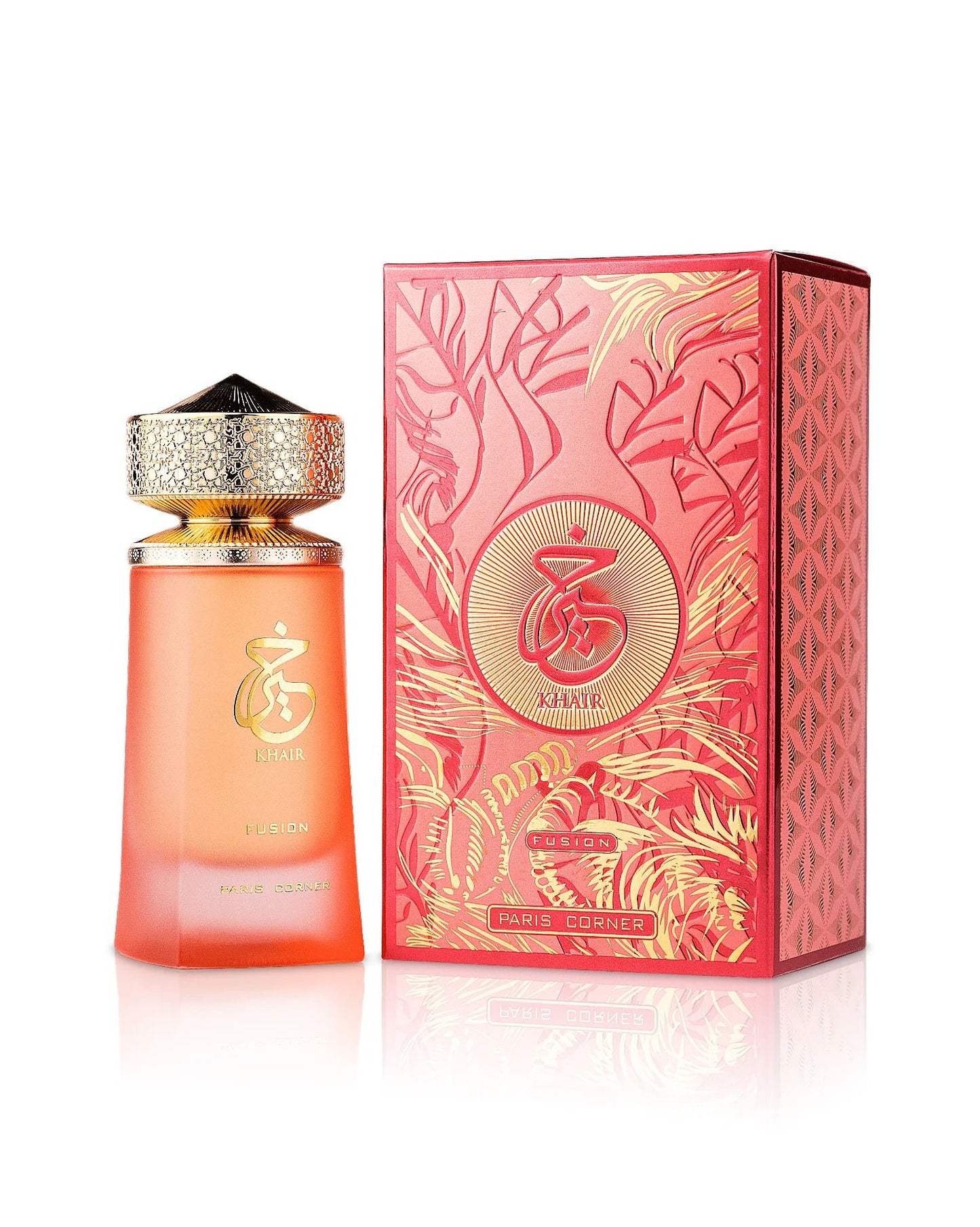 Elegant display of Khair Fusion perfume by Paris Corner, featuring the orange gradient bottle with a gold, textured cap next to its matching red and gold patterned retail box. The Arabic script logo is prominent on both the bottle and the box.
