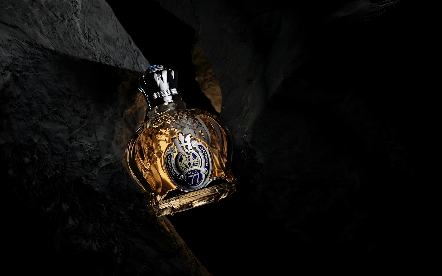 Majestic Designer Shaik Gold Edition 77 perfume bottle nestled between natural rocks.