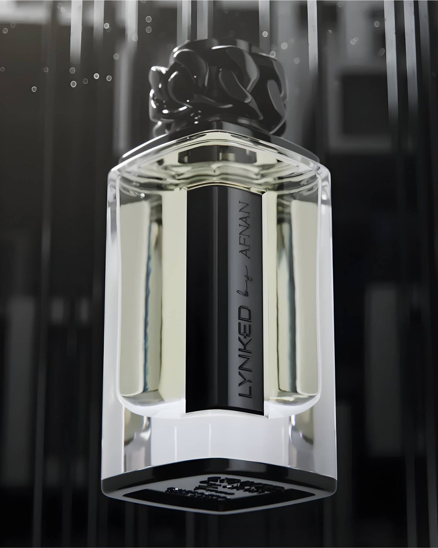 Low-angle close-up of the Lynked by Afnan Freedom perfume bottle featuring a black sculptural chain-link cap against a dark, atmospheric background.