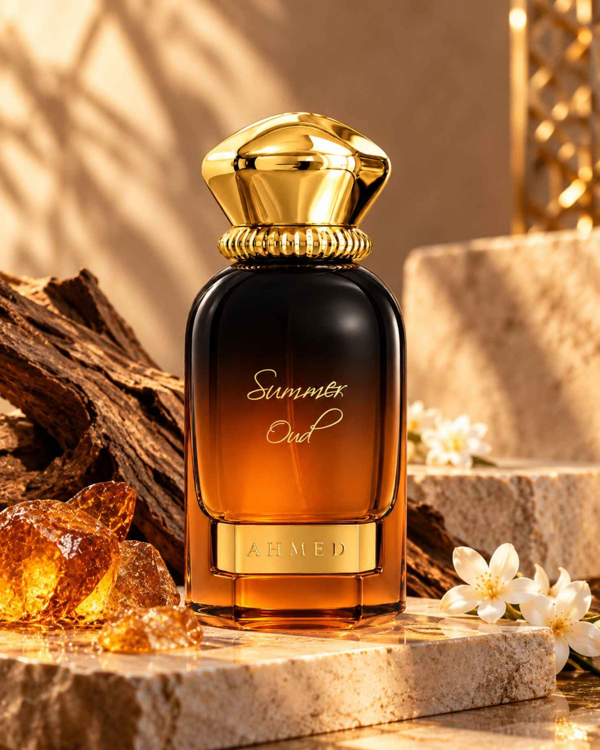 Ahmed al maghribi Summer Oud Extrait de Parfum bottle styled on a stone surface with amber resin crystals, rough oud wood, and blooming white flowers under warm lighting.