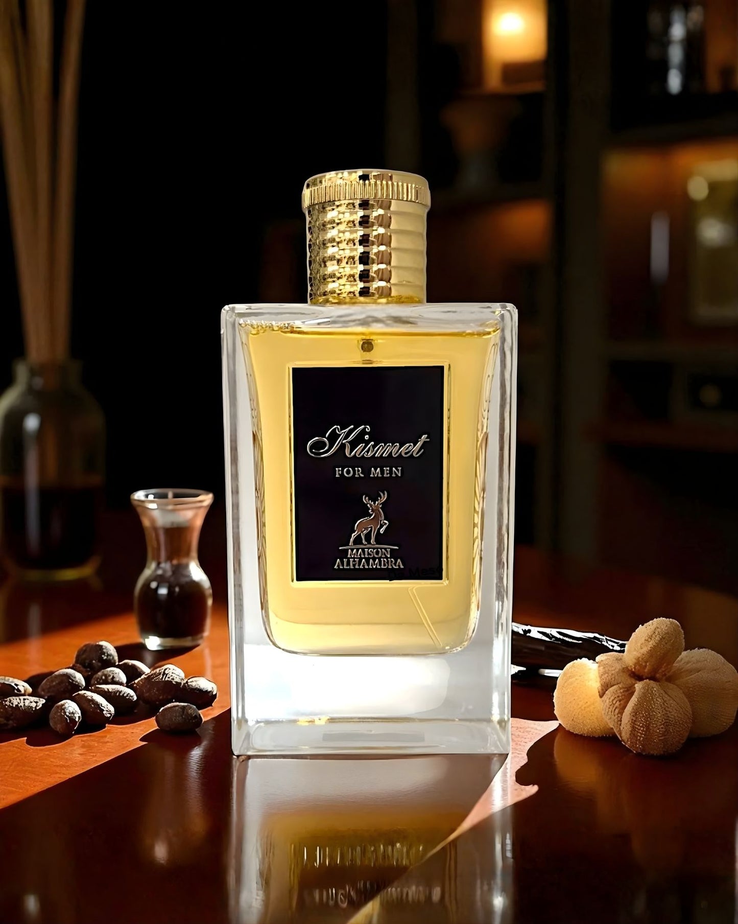 A bottle of Kismet for Men edp perfume displayed on a wooden table with coffee beans and vanilla pods in warm lighting.