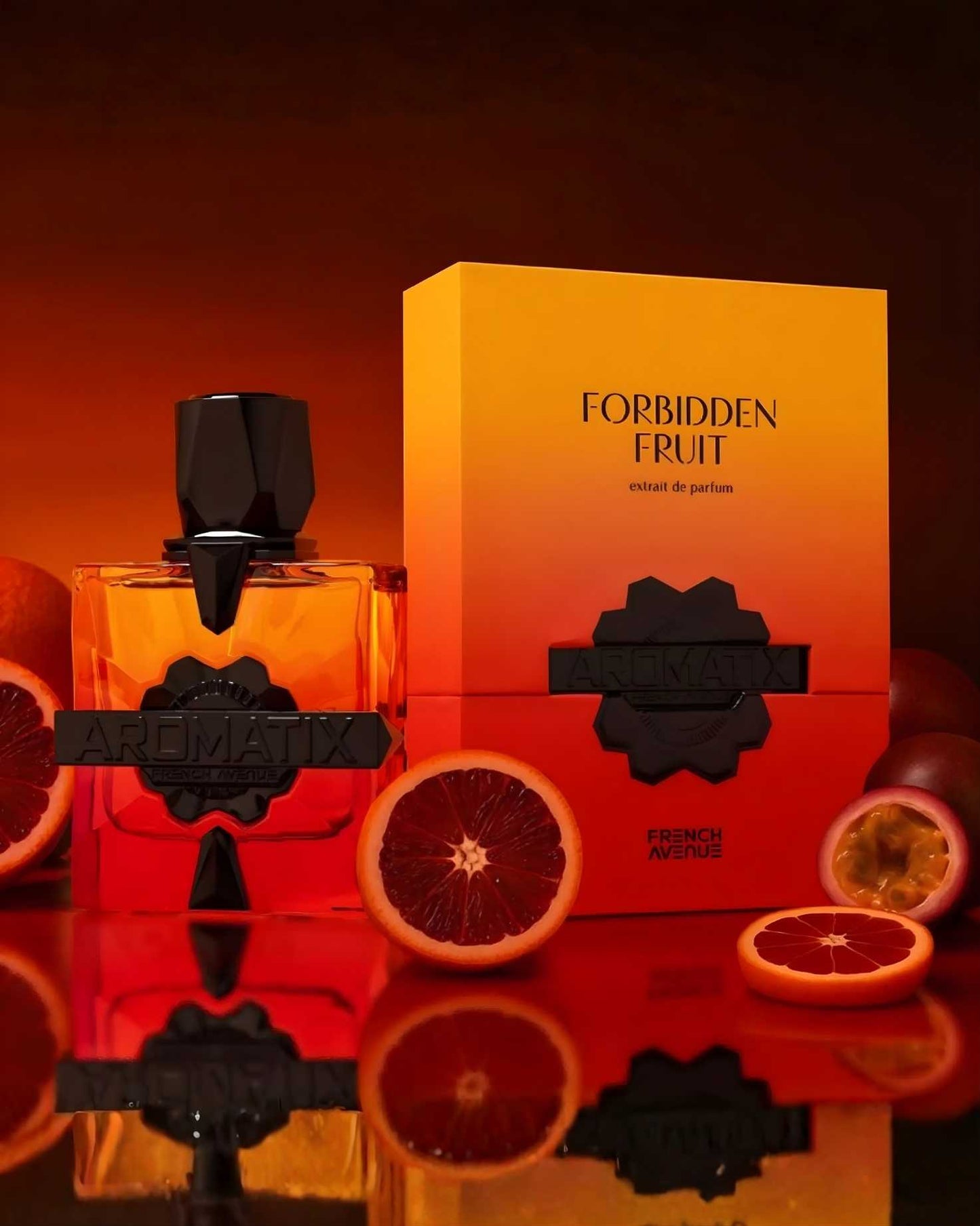 Product lifestyle photo of French Avenue Aromatix Forbidden Fruit ExDP perfume bottle surrounded by sliced blood oranges and passionfruit on a reflective red surface.