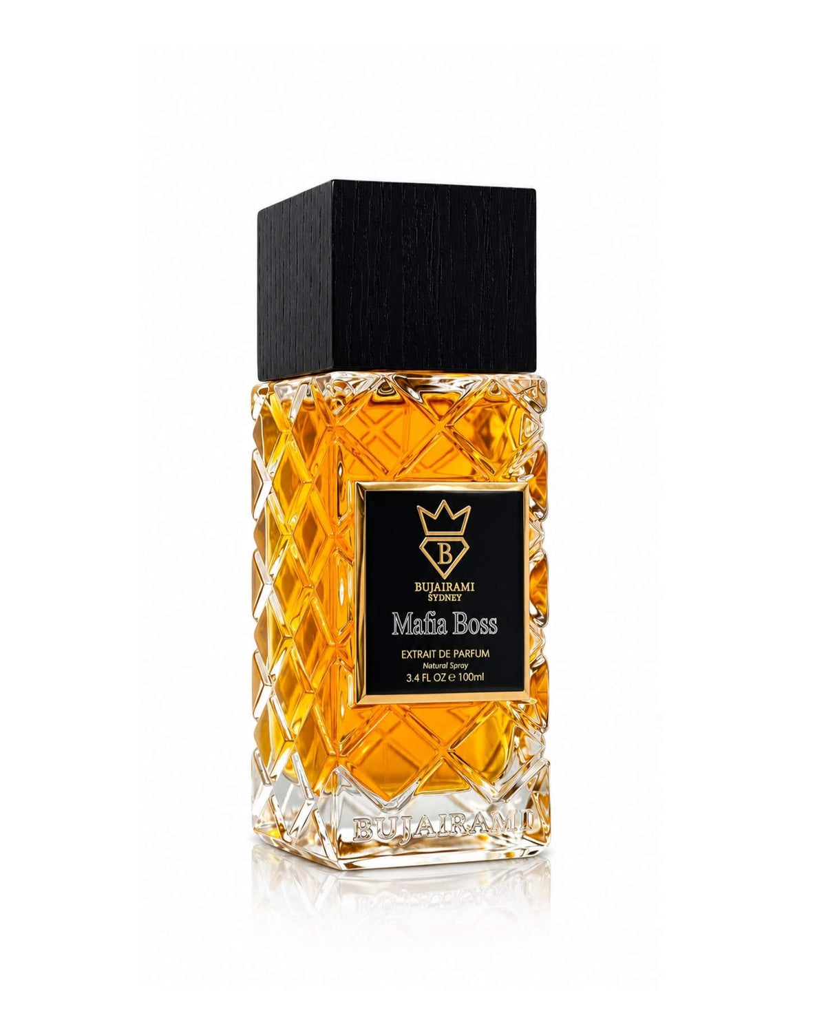 Three-quarter side angle view of the Bujairami Sydney Mafia Boss Extrait de Parfum 100ml bottle, highlighting the quilted crystal glass pattern, embossed base branding, black wood cap, and gold-bordered label on a white background.