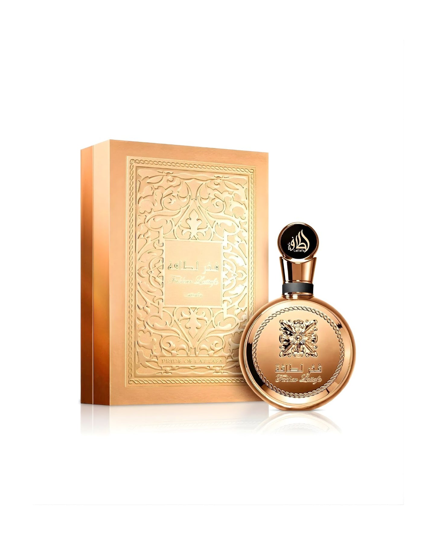 The Lattafa "Fakhar Lattafa" Eau de Parfum set, showing the round, all-gold bottle next to its tall, matching gold box, which has an embossed panel featuring intricate Arabian filigree and text.