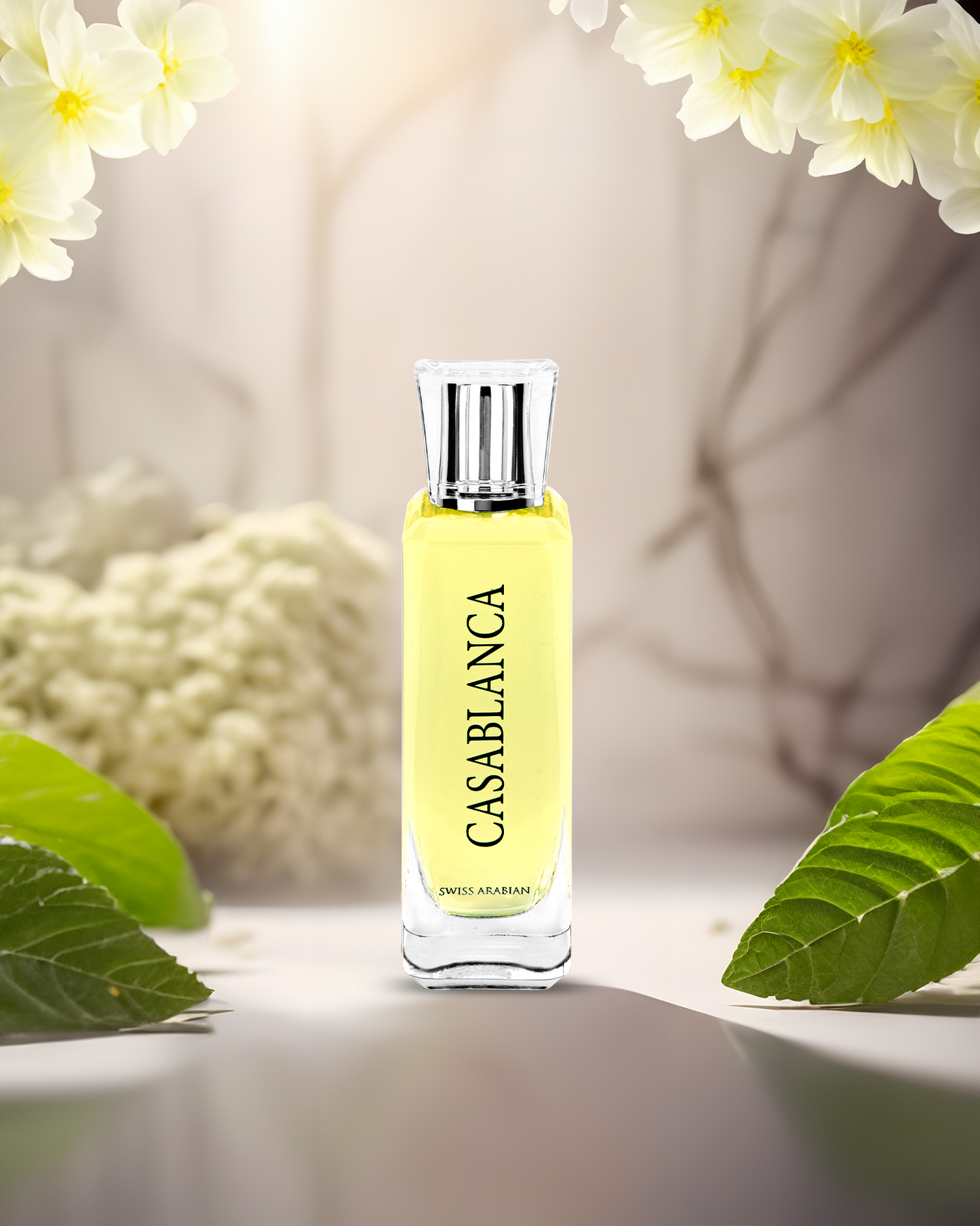 swiss arabian casablanca perfume bottle among white flowers and green leaves conveying a fresh floral fragrance.