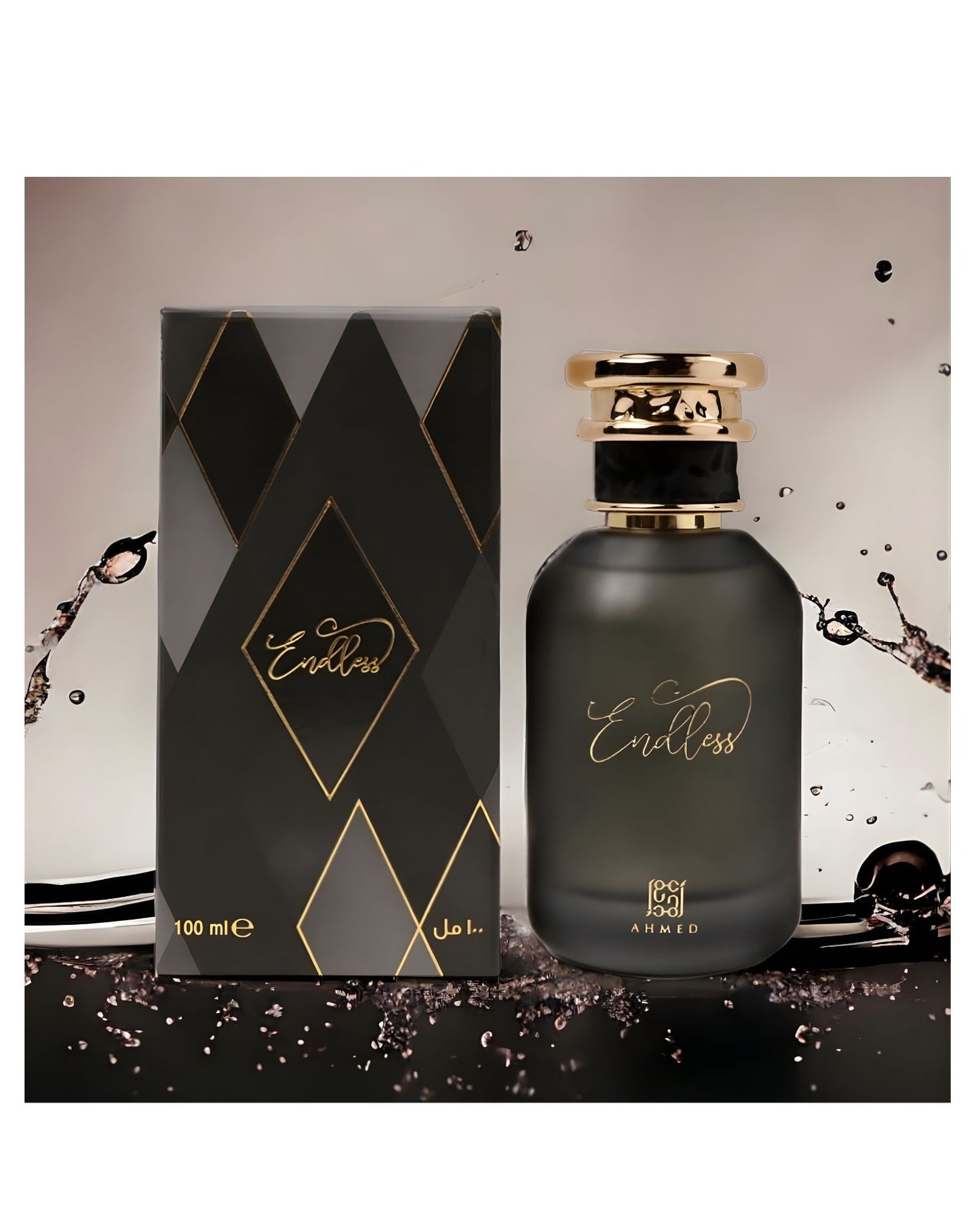A dramatic, high-contrast product photo of AHMED "Endless" Eau de Parfum, 100ml, showing the dark bottle and its matching black, gold, and gray diamond-patterned box. The presentation is dynamic, with splashes of dark liquid and a sleek, reflective surface, creating a sophisticated and luxurious atmosphere.