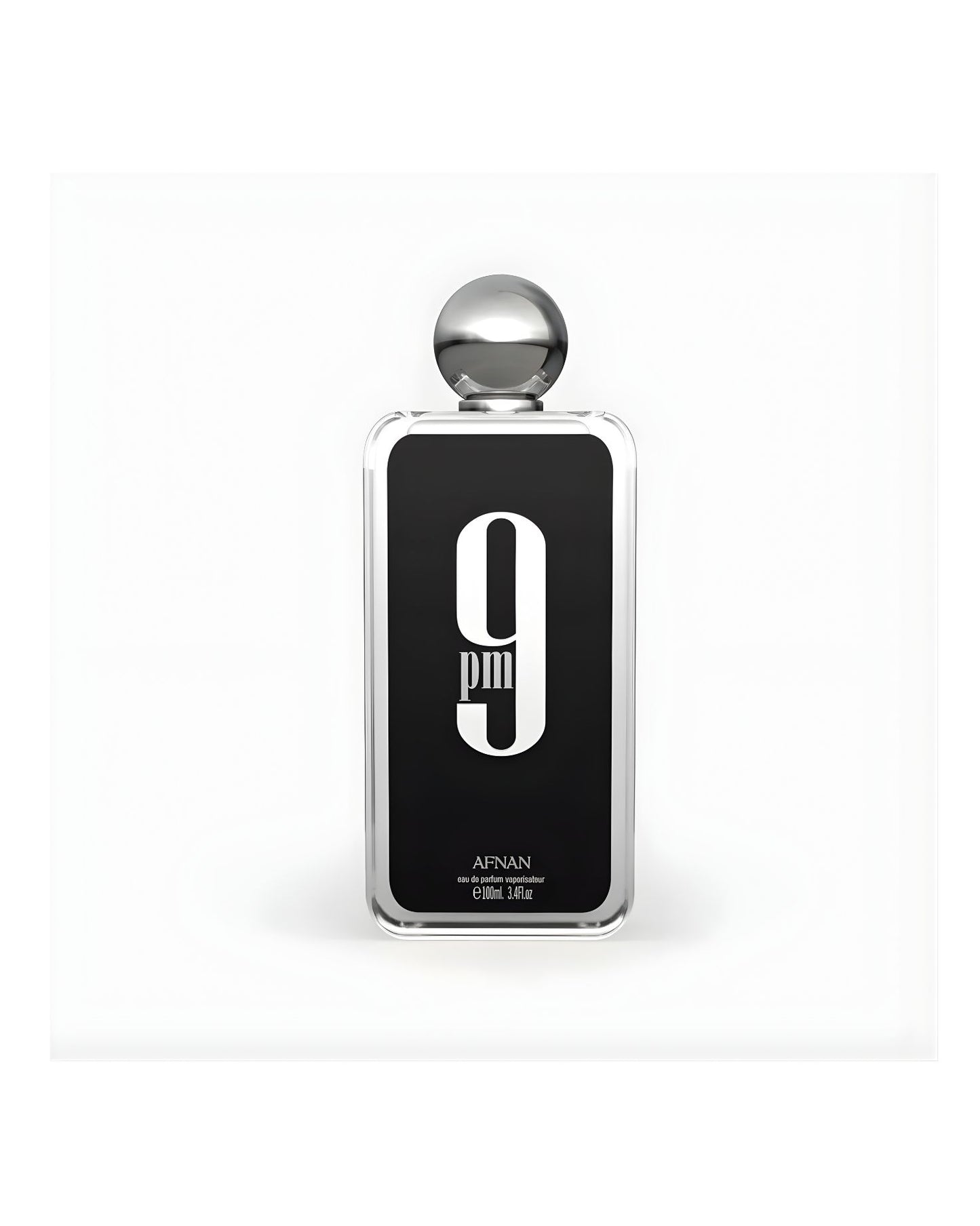 A rectangular glass bottle of Afnan 9 PM Eau de Parfum, 100ml / 3.4 fl.oz., featuring a black label with a large white "9 PM" graphic and a silver spherical cap, set against a white background.