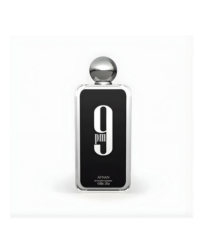 A rectangular glass bottle of Afnan 9 PM Eau de Parfum, 100ml / 3.4 fl.oz., featuring a black label with a large white "9 PM" graphic and a silver spherical cap, set against a white background.