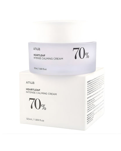 The Anua Heartleaf 70 Intense Calming Cream jar resting on its product box, with the ingredients list and cautions visible on the side of the box.