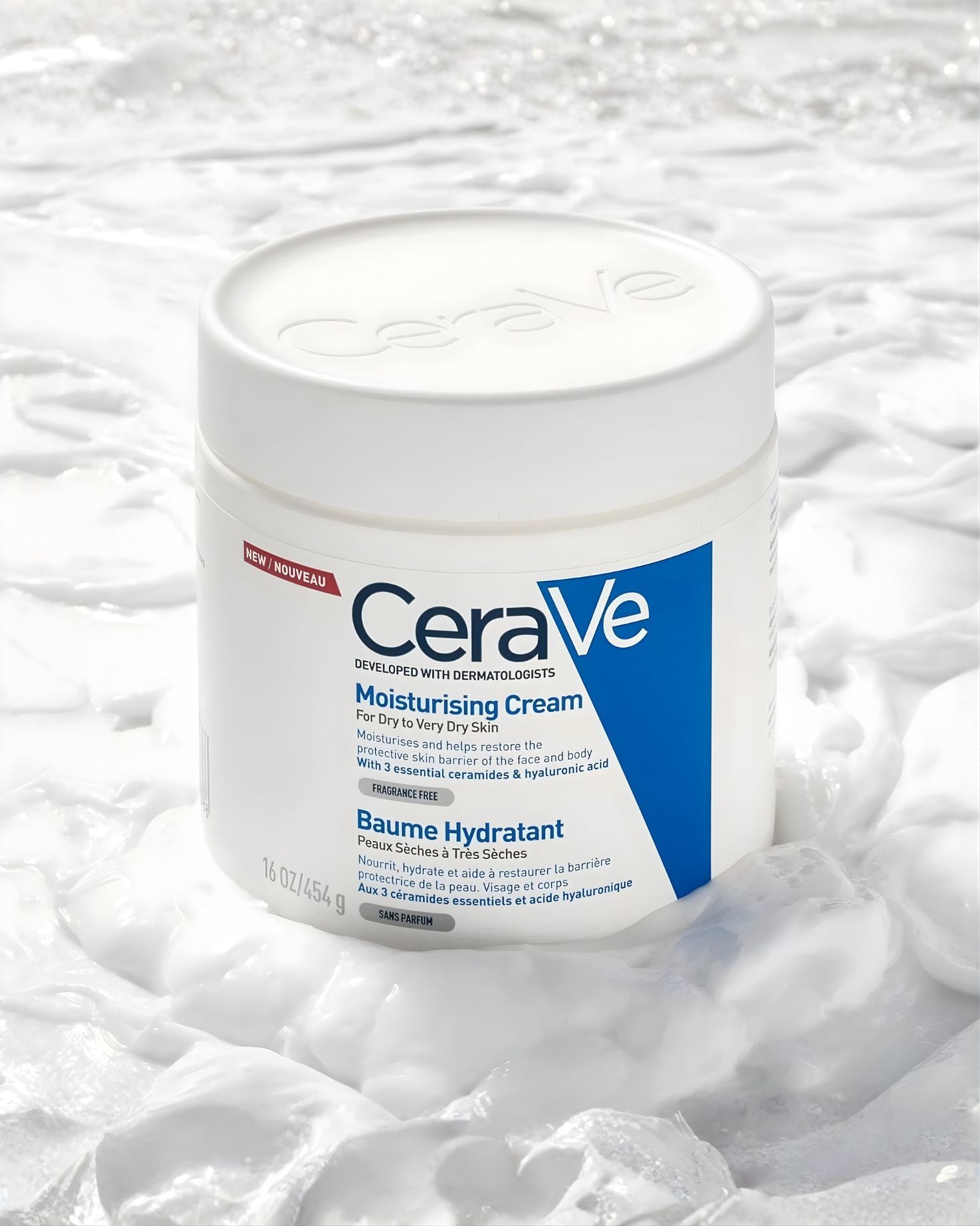 CeraVe Moisturising Cream 16 oz tub resting on a bed of thick, white cream, highlighting its texture and moisturizing benefit for dry to very dry skin.