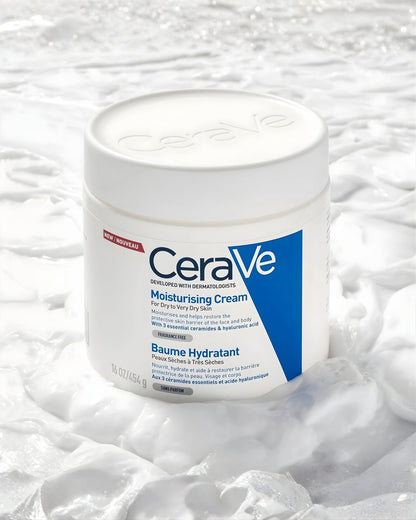 CeraVe Moisturising Cream 16 oz tub resting on a bed of thick, white cream, highlighting its texture and moisturizing benefit for dry to very dry skin.
