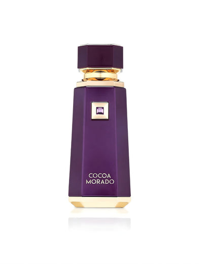 A tall, geometric perfume bottle labeled "Cocoa Morado," featuring a deep, rich purple color, a matching octagonal cap, and metallic gold base and neck accents, isolated against a white background
