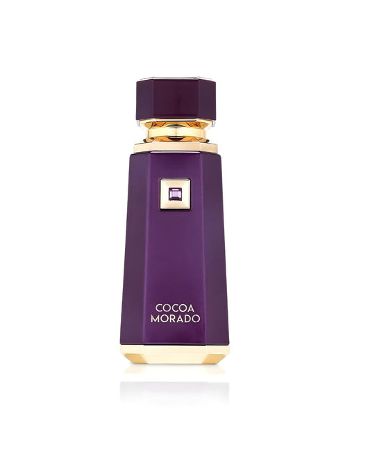 A tall, geometric perfume bottle labeled "Cocoa Morado," featuring a deep, rich purple color, a matching octagonal cap, and metallic gold base and neck accents, isolated against a white background
