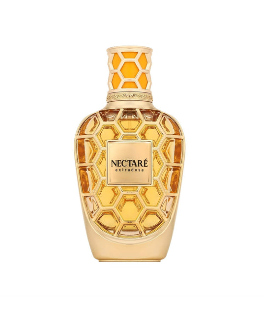 French avenue Nectaré Extradose ExDP luxury perfume in an ornate gold honeycomb-patterned glass bottle with amber-colored liquid.