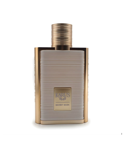 A sophisticated rectangular perfume bottle labeled "khadlaj Karus Secret Musk," featuring a gold metallic frame, a gold ridged cap, and a central panel in textured beige or off-white, isolated against a white background.