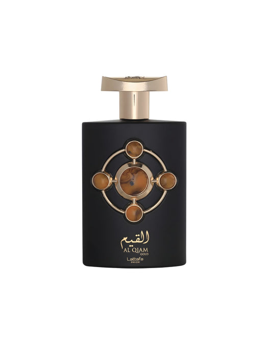 Black perfume bottle with a gold cap and a circular gold emblem featuring four amber-colored stones and a central marbled stone. The label reads "القيم AL'QIAM GOLD Lattafa PRIDE.