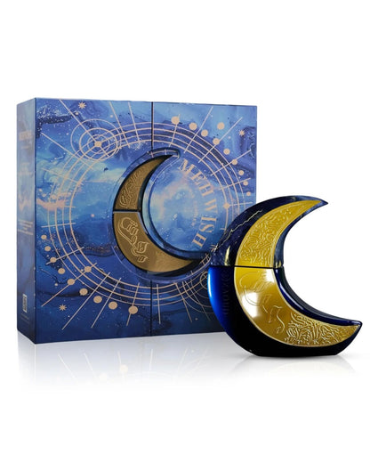 The Paris Corner Mehwise Edp perfume set, showing a crescent moon-shaped bottle with a glossy dark blue and gold embossed design next to its matching blue, starry-themed magnetic box, which is decorated with a celestial, gold astrological wheel design.