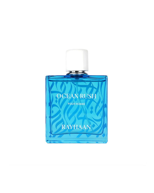 A bright, square blue perfume bottle for Rayhaan Ocean Rush Pour Homme. It has a white cap and a wave-like pattern on the glass.