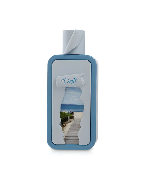 Riiffs Seasons Drift Edp fragrance bottle with a blue frame, showing a cutout view of a wooden boardwalk leading to a beach and ocean.