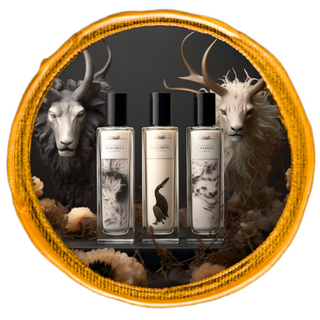 Three premium Animalic Infused Perfume bottles displayed in the foreground, with the heads of two horned animals in the background.