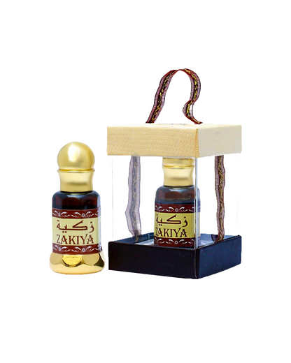 Zakiya dahn al oud attar bottle and accompanying box displayed against a white background.