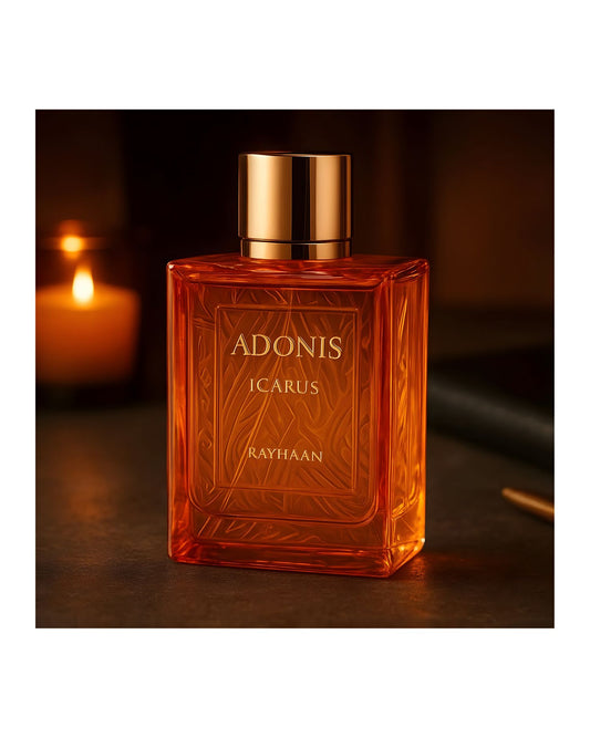 Adonis Icarus Rayhaan perfume bottle in an orange-amber square glass bottle with a gold cap, shown in a warm, low-light setting next to a lit candle.