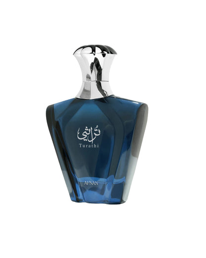 Side angle view of the Afnan Turathi Blue fragrance bottle, highlighting the faceted blue glass design and silver decorative cap.