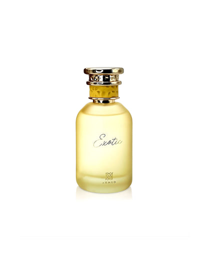 Frosted yellow glass perfume bottle labeled "Exotic" with a gold cap, produced by Ahmed.