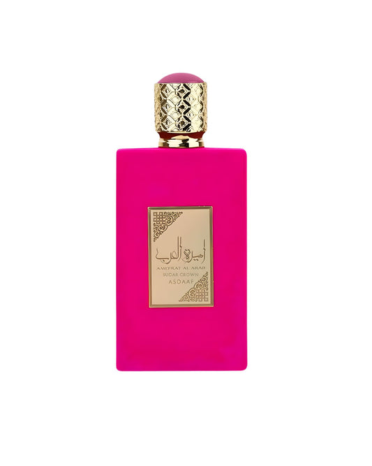 A rectangular vibrant hot pink perfume bottle labeled Ameerat Al Arab Sugar Crown Edp by Asdaaf. The bottle features a gold-engraved label with Arabic calligraphy and is topped with an ornate gold cap and a matching pink circular detail.
