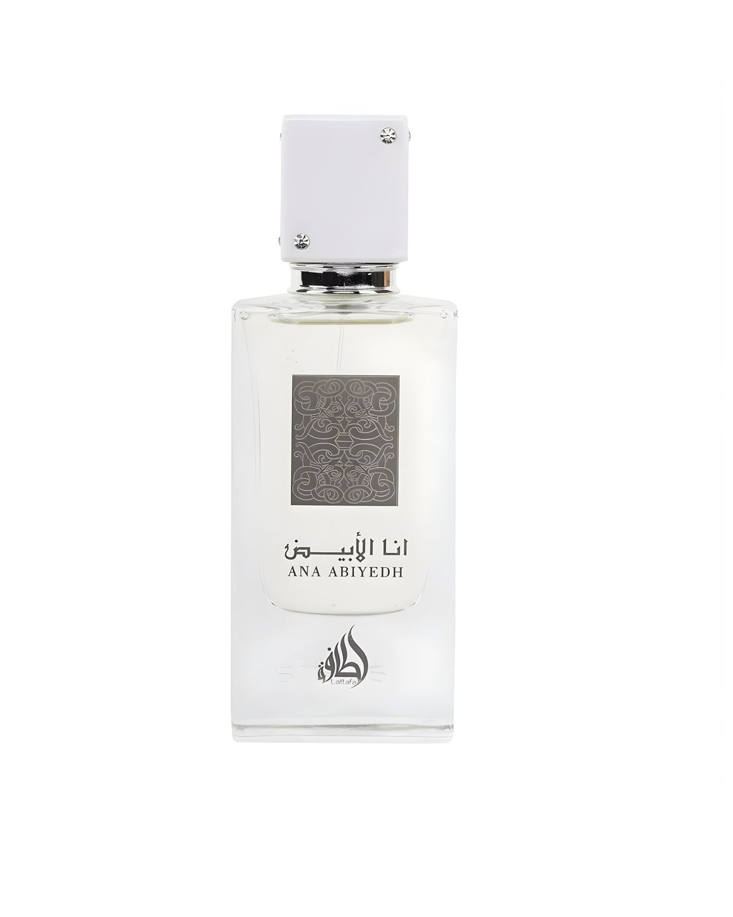 A clear, rectangular perfume bottle containing colorless liquid, labeled with dark gray Arabic calligraphy and the text 'ANA ABIYYEDH'. The bottle has a square white cap accented with four small clear jewels, isolated against a bright white background.