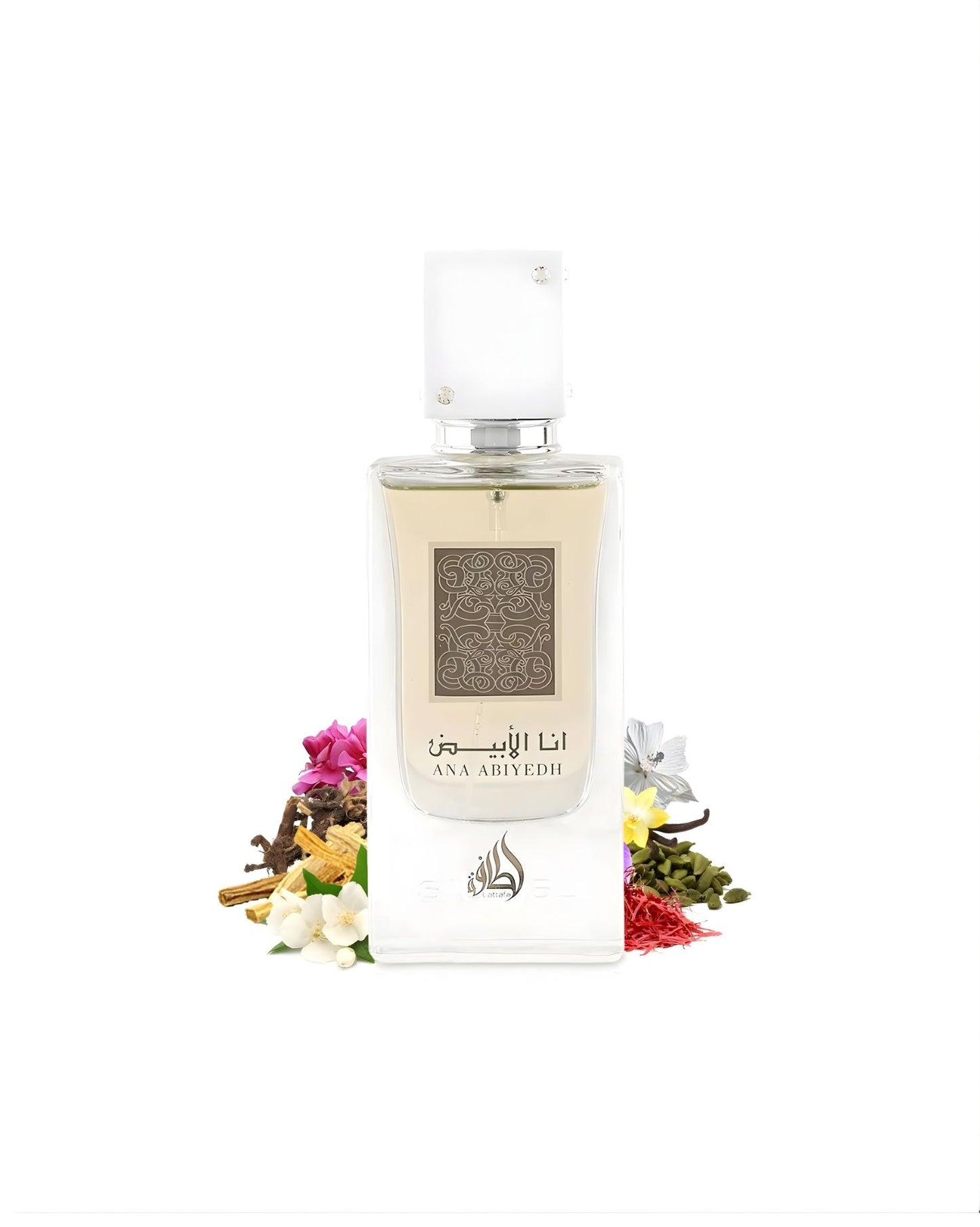The rectangular 'Ana Abiyedh' perfume bottle with a white cap is surrounded by a pile of various raw fragrance ingredients, including saffron threads, cardamom pods, vanilla beans, small white and pink flowers, and pieces of wood/cinnamon sticks.