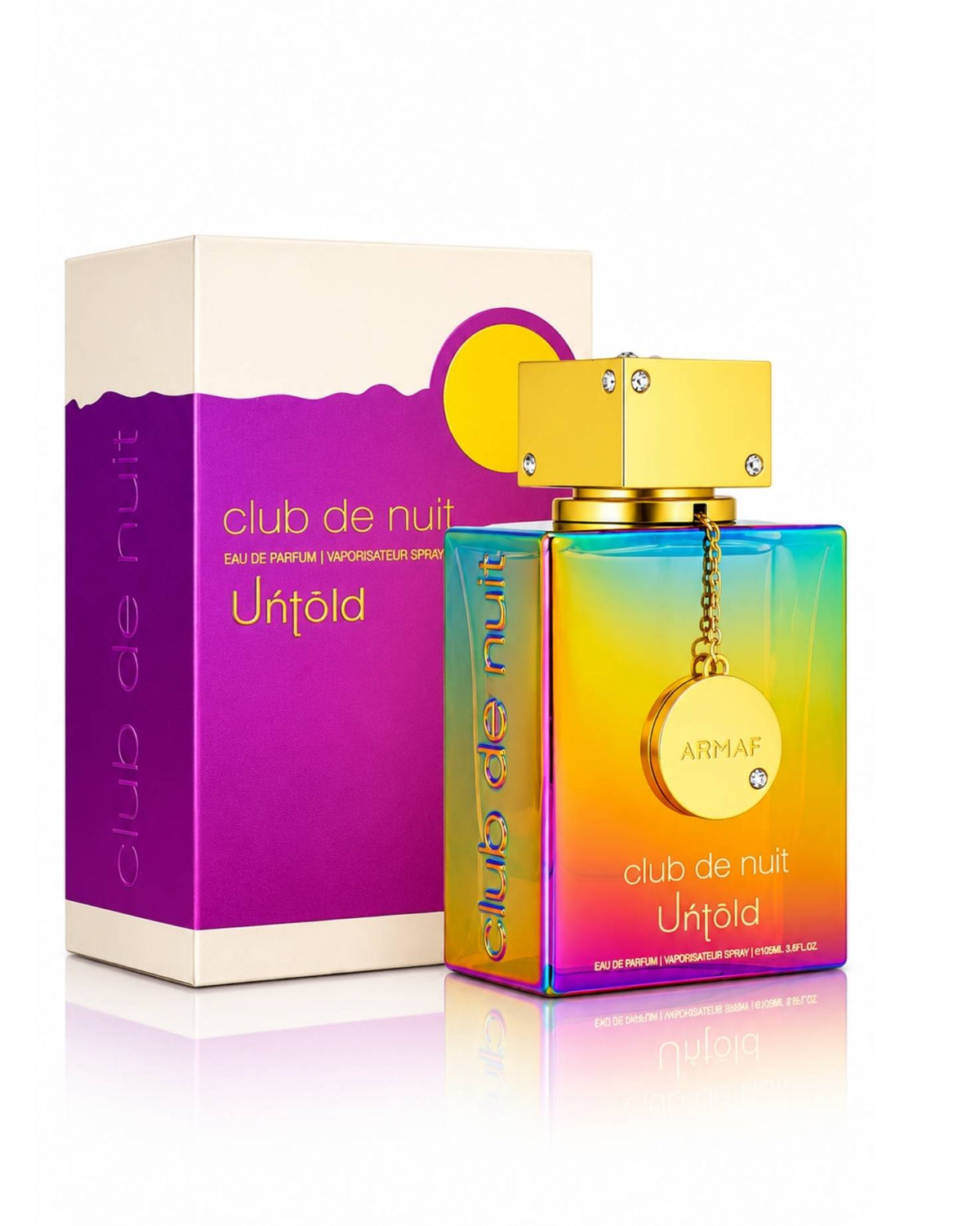 Armaf Club de Nuit Untold Eau de Parfum iridescent rainbow bottle with a gold cap standing beside its purple, white, and yellow packaging box on a reflective white surface.