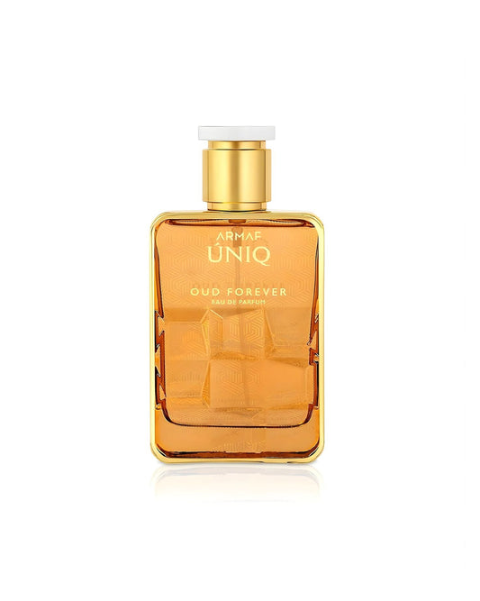 A rectangular Armaf Uniq Oud Forever Eau de Parfum bottle in a reflective gold finish, featuring a textured geometric pattern on the body and a gold cap with a white top, isolated against a white background.