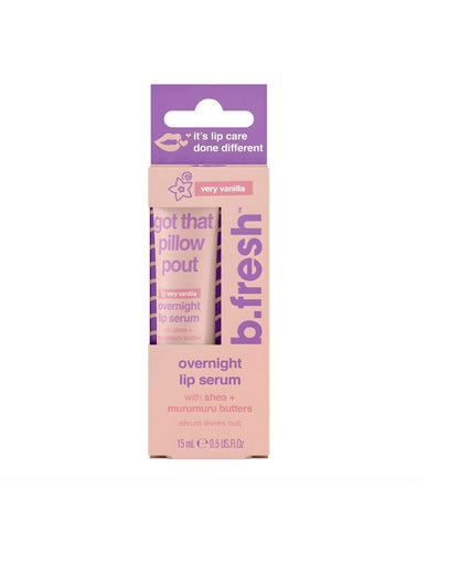 A product photo of the b.fresh very vanilla overnight lip serum packaging, a light pink box with purple text, stating "I got that pillow pout" and highlighting shea + murumuru butter. The tube inside is also visible.