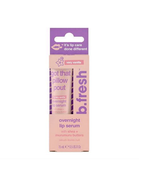 A product photo of the b.fresh very vanilla overnight lip serum packaging, a light pink box with purple text, stating "I got that pillow pout" and highlighting shea + murumuru butter. The tube inside is also visible.