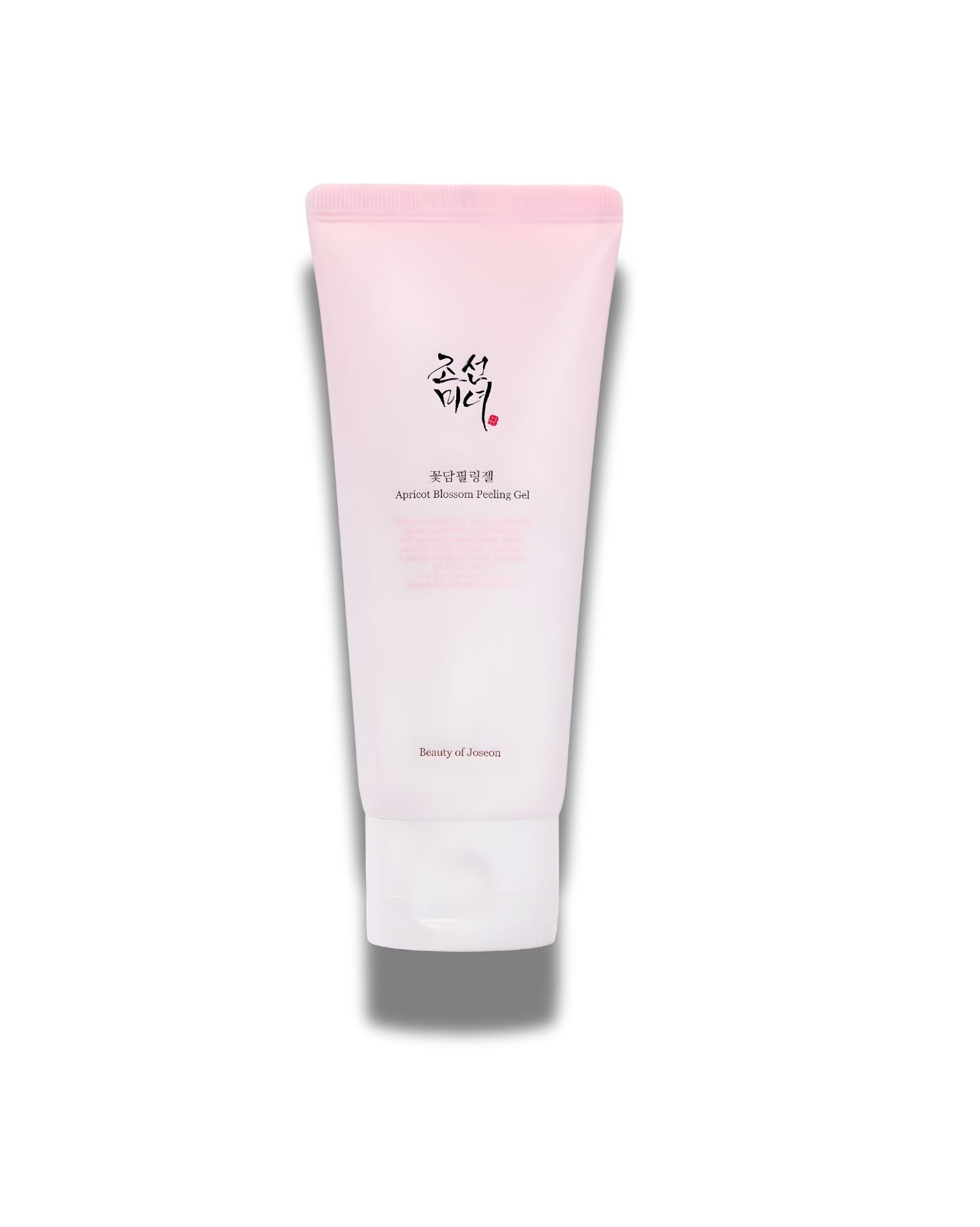 A close-up of the Beauty of Joseon Apricot Blossom Peeling Gel in its pink and white squeeze tube packaging.