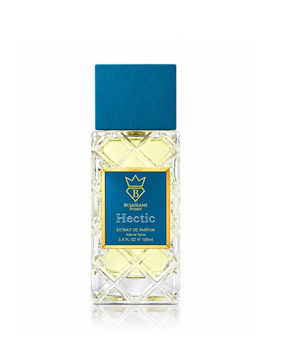 Bujairami Sydney Hectic Extrait de Parfum 100ml bottle featuring clear quilted crystal glass, a blue wooden cap, and a gold-bordered blue label on a plain white background.
