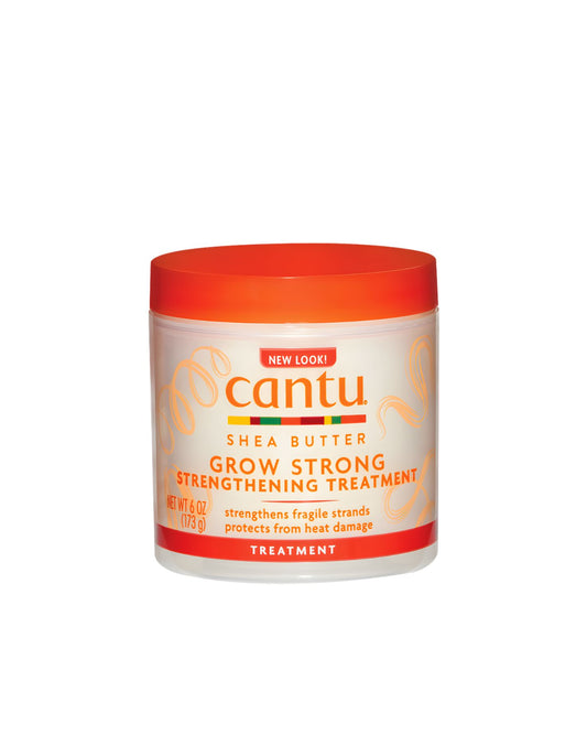 A jar of Cantu Shea Butter Grow Strong Strengthening Treatment, featuring an orange lid and label detailing its use for strengthening fragile hair strands and heat damage protection.