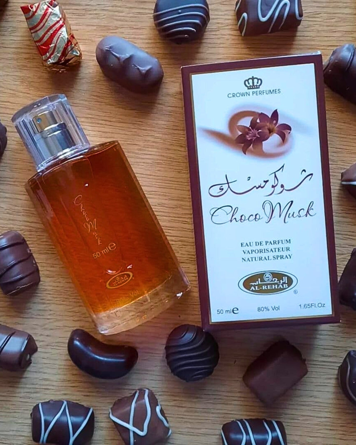 choco_musk_perfume_bottle_photograph_besides_chocolates