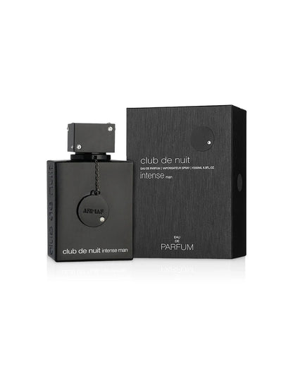 The Armaf Club de Nuit Intense Man Eau de Parfum set, featuring the black bottle with a jewel-studded cap and chain-tag next to its matching black box with a textured, carbon-fiber-like design.