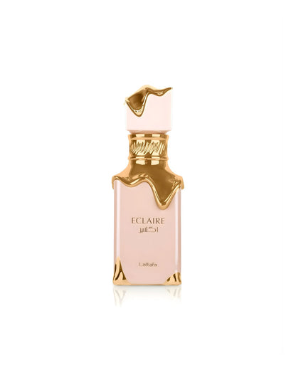 A pale pink rectangular Lattafa Eclaire perfume bottle featuring a highly stylized gold design that appears to be dripping or melting down from the neck and cap, set against a white background.
