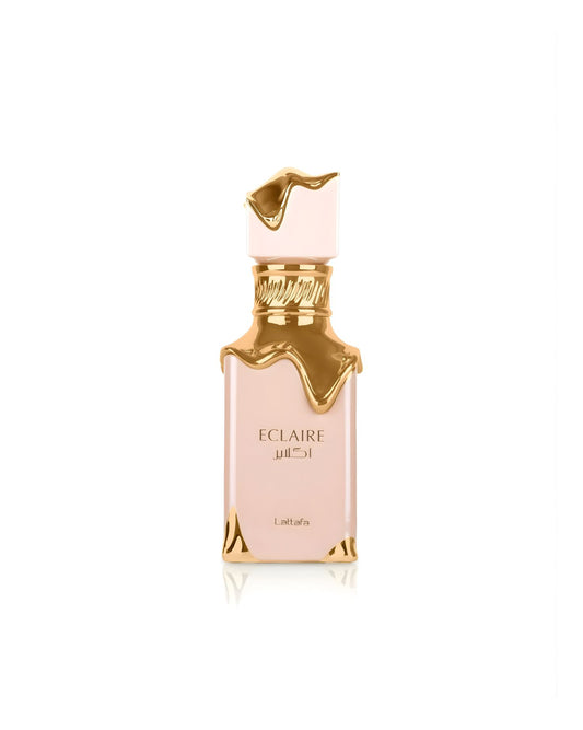 A pale pink rectangular Lattafa Eclaire perfume bottle featuring a highly stylized gold design that appears to be dripping or melting down from the neck and cap, set against a white background.