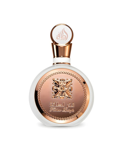 A sleek, circular Lattafa "Fakhar Lattafa" perfume bottle, featuring a white body encased by a striking rose gold panel with an ornate central emblem and chain-link border, against a white background.