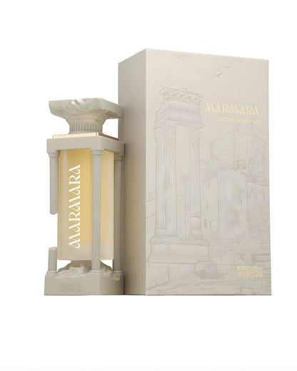 Marmara Extrait de Parfum by French Avenue showing the luxury column-shaped bottle next to its elegant beige packaging box featuring architectural sketches.