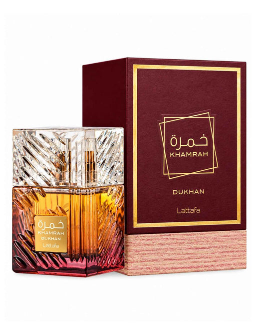 Lattafa Khamrah Dukhan Eau de Parfum textured glass bottle displayed next to its burgundy and gold box packaging.