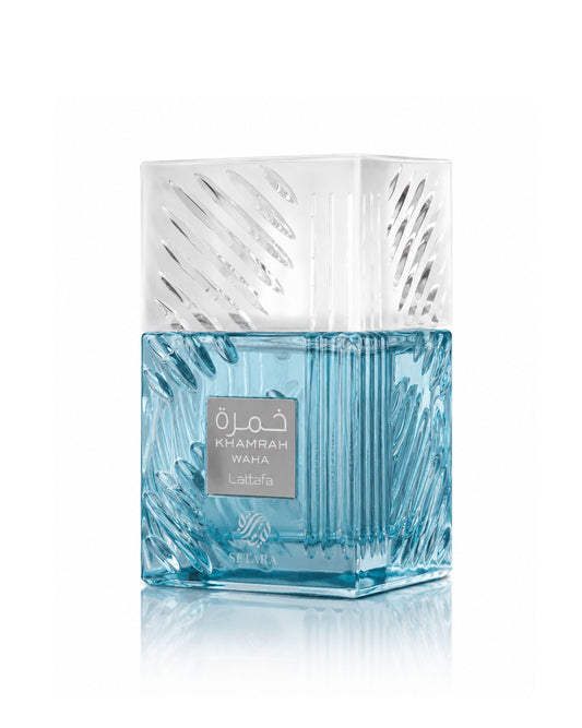 Lattafa Khamrah Waha Eau de Parfum bottle with clear textured cap and light blue liquid on a white background.