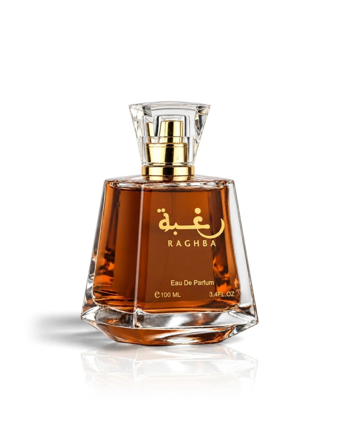 Lattafa Raghba Eau de Parfum trapezoidal glass bottle with warm amber liquid, gold Arabic calligraphy, and a clear faceted cap against a plain white background.