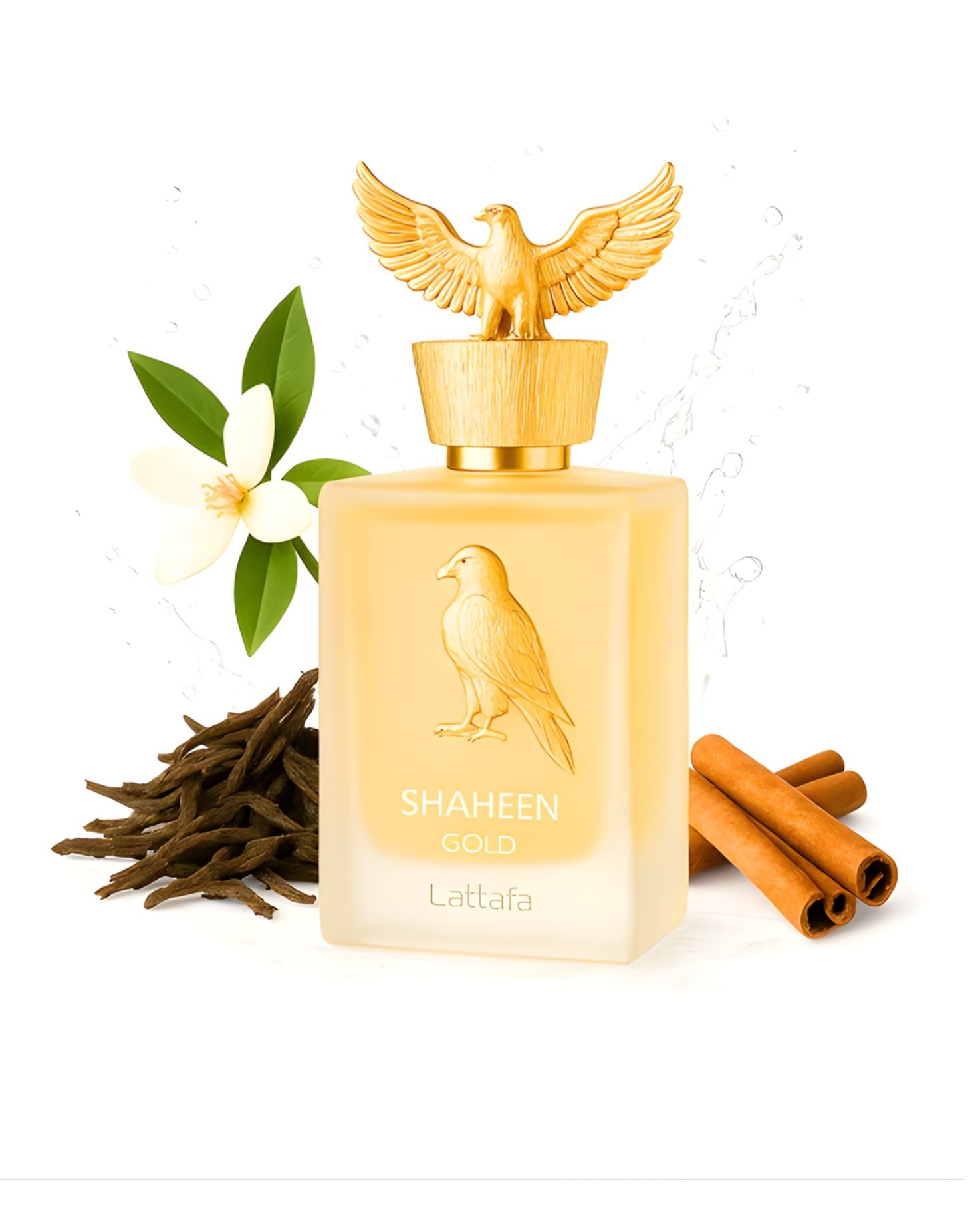 A bottle of Lattafa Shaheen Gold Edp perfume surrounded by its scent notes: a pile of dark vanilla beans, sticks of cinnamon, and a white jasmine flower, with a dynamic water splash in the background.