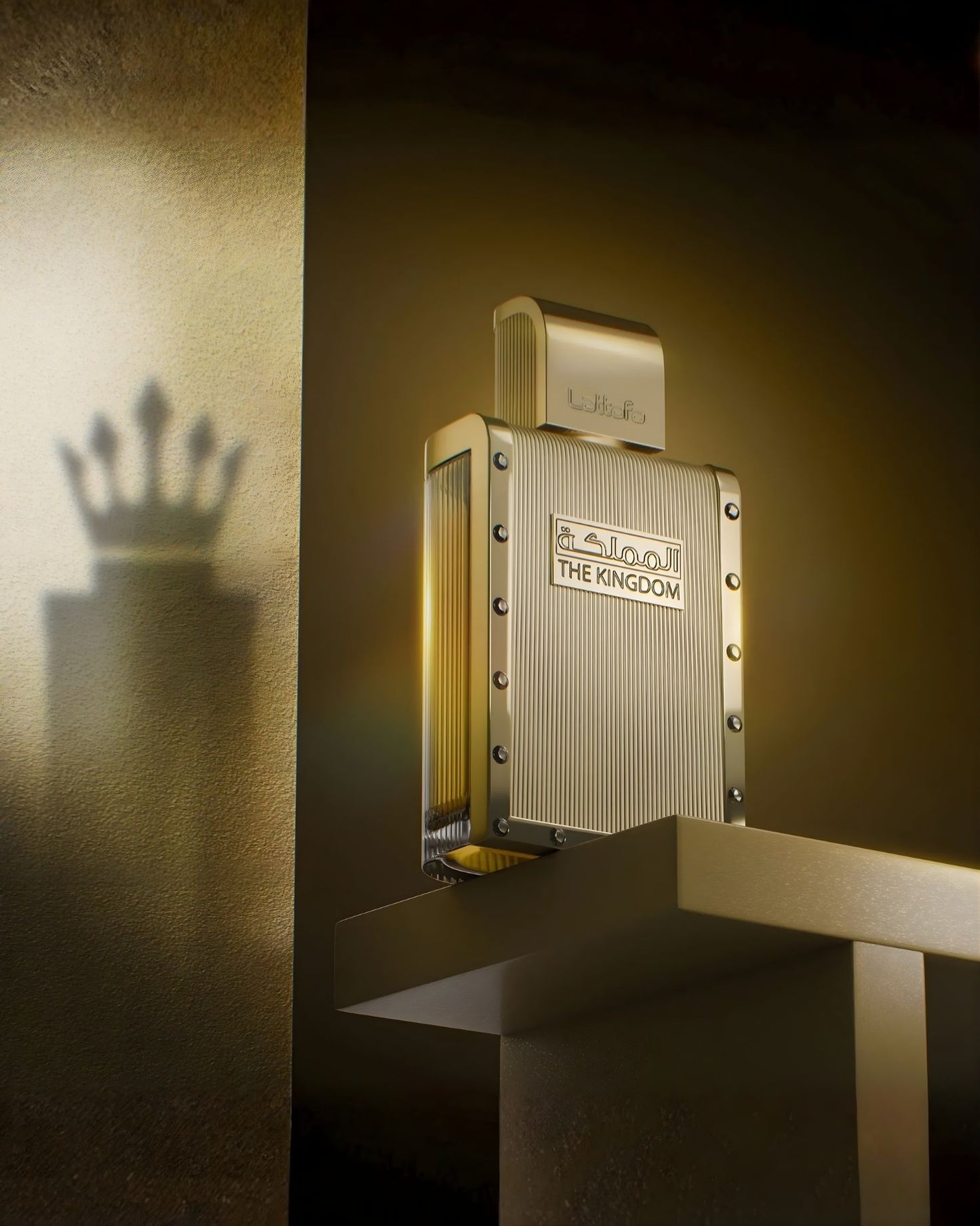 Artistic shot of Lattafa The Kingdom for men edp perfume on a pedestal with a crown-shaped shadow against a gold wall.